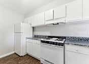 Thumbnail 34 of 51 - Kitchen with white appliances at The Reserve at Brookhaven, Atlanta
