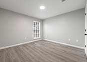 Thumbnail 15 of 29 - Room with wooden floor at 2000 Oasis Apartments, Atlanta, 30316