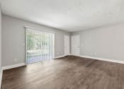 Thumbnail 37 of 52 - Spacious living room with new flooring at Pines at Lawrenceville Decatur 30033