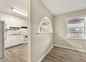 Thumbnail 5 of 32 - A kitchen with white appliances at Balfour 296, Lilburn, GA 30047