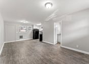 Thumbnail 11 of 19 - a living room with hardwood floors and grey walls  at Balfour 296, Lilburn, GA