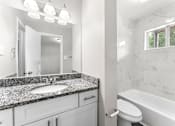 Thumbnail 12 of 19 - a bathroom with a sink toilet and bathtub  at Balfour 296, Lilburn, Georgia