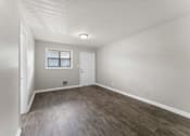 Thumbnail 7 of 19 - a bedroom with hardwood floors and grey walls  at Balfour 296, Lilburn, Georgia