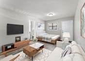 Thumbnail 1 of 19 - a bedroom with a bed and a tv in a room  at Balfour 296, Lilburn