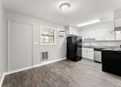 Thumbnail 8 of 19 - a kitchen and living room with a refrigerator and dishwasher  at Balfour 296, Georgia, 30047