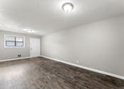 Thumbnail 6 of 19 - a bedroom with hardwood floors and grey walls  at Balfour 296, Lilburn, GA