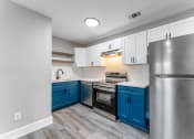 Thumbnail 4 of 32 - Stainless Steel Appliances Quartz Countertops Stylish Cabinetry at Woodbriar Management, LLC, Tucker, GA, 30084