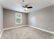 Thumbnail 12 of 32 - Carpeted Bedroom at Woodbriar Management, LLC, Tucker, Georgia