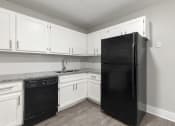Thumbnail 4 of 22 - Fully Equipped Kitchens with all Electric Stove & Refrigerator at Ridgewood Apartments, Georgia