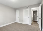 Thumbnail 12 of 22 - Carpeted Bedroom at Ridgewood Apartments, Lawrenceville, GA