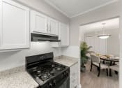 Thumbnail 7 of 47 - Updated kitchen granite countertops soft-close cabinetry black appliances at 445 Cleveland, Atlanta, GA 30354