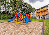 Thumbnail 10 of 35 - Play area at Pinewood Townhomes, Tucker, 30084