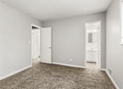 Thumbnail 28 of 35 - Bedroom with white bath at Pinewood Townhomes, Tucker, 30084