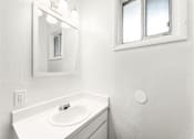 Thumbnail 33 of 35 - White sink in bathroom at Pinewood Townhomes, Tucker
