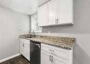 Thumbnail 31 of 35 - White cabinets and sink in kitchen at Pinewood Townhomes, Tucker, GA, 30084