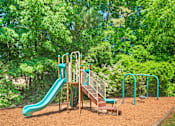 Thumbnail 17 of 35 - Play area with slide at Pinewood Townhomes, Tucker, Georgia