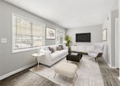 Thumbnail 23 of 35 - Living room with modern TV at Pinewood Townhomes, Tucker, 30084