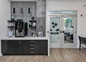 Thumbnail 13 of 47 - A black and white kitchen with a wooden floor.