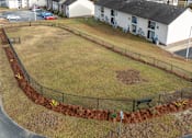 Thumbnail 21 of 25 - A park with a baseball diamond and a fence.