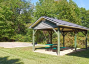 Thumbnail 11 of 27 - a picnic pavilion with a picnic table