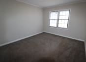 Thumbnail 13 of 29 - an empty room with carpet and a window