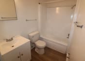 Thumbnail 15 of 29 - an empty bathroom with a toilet and a shower
