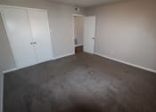 Thumbnail 7 of 29 - an empty room with carpet and white doors