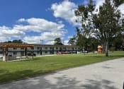 Thumbnail 7 of 25 - the building where the motel is located has a park in front of it