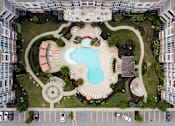 Thumbnail 7 of 25 - A bird's eye view of a courtyard with a fountain and a swimming pool.at Residence at Marina Bay, Irmo