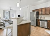 Thumbnail 13 of 25 - A modern kitchen with wooden cabinets and stainless steel appliances.at Residence at Marina Bay, Irmo, 29063