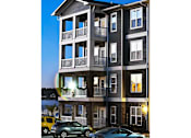 Thumbnail 24 of 25 - A building with a balcony and cars parked in front.at Residence at Marina Bay, Irmo, SC
