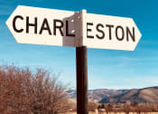 Thumbnail 5 of 28 - a street sign that reads in front of the mountains