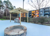 Thumbnail 19 of 27 - a fire pit and a pavilion in the snow