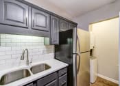 Thumbnail 18 of 27 - the preserve at ballantyne commons apartments renovated kitchen with stainless steel refrigerator