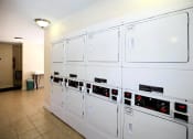 Thumbnail 23 of 27 - a row of white refrigerators in a room