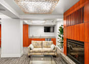 Thumbnail 8 of 50 - a living room with a couch and a fireplace