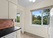 Thumbnail 22 of 50 - a kitchen with a sink and a window