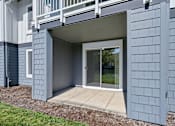 Thumbnail 48 of 50 - a covered patio with a sliding glass door at Summer Creek Apartments, Tigard, 97223