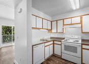 Thumbnail 11 of 50 - White Kitchen at Summer Creek Apartments, Tigard