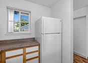 Thumbnail 29 of 50 - a kitchen with a refrigerator and a window at Summer Creek Apartments, Tigard, 97223