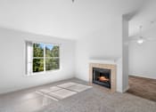 Thumbnail 19 of 50 - a living room with a fireplace and a window at Summer Creek Apartments, Oregon, 97223