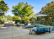 Thumbnail 5 of 47 - a terrace with couches and chairs and trees
