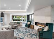 Thumbnail 11 of 47 - a living room filled with furniture and a fireplace