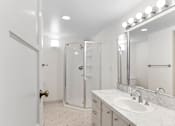 Thumbnail 29 of 47 - a bathroom with a sink and a shower