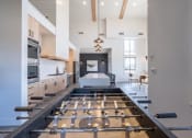 Thumbnail 19 of 27 - a large kitchen with a large island in the middle at Sonder Fields in Happy Valley, OR