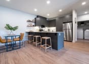 Thumbnail 2 of 27 - a kitchen and dining room with a table and chairs at Sonder Fields in Happy Valley, OR