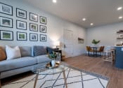 Thumbnail 3 of 27 - a living room with a couch and a table at Sonder Fields in Happy Valley, OR