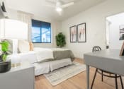Thumbnail 6 of 27 - a bedroom with a bed and a desk and a window at Sonder Fields in Happy Valley, OR