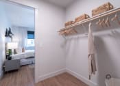 Thumbnail 7 of 27 - a bathroom with a closet and a mirror in a living room at Sonder Fields in Happy Valley, OR