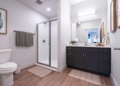 Thumbnail 9 of 27 - a bathroom with a toilet sink and a shower at Sonder Fields in Happy Valley, OR